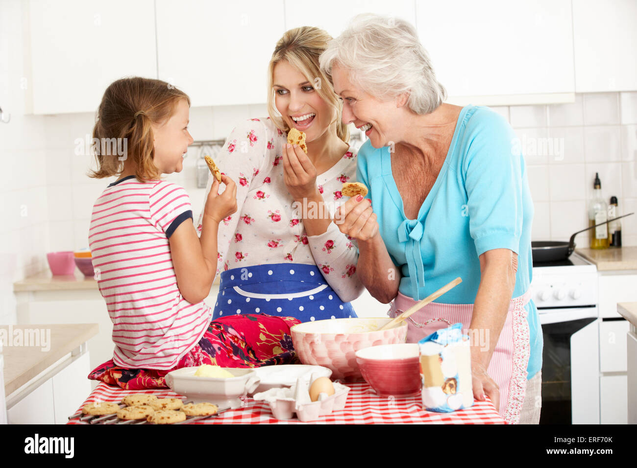 Mother,Daughter And Grandmother Baking In Kitchen Stock Photo - Alamy