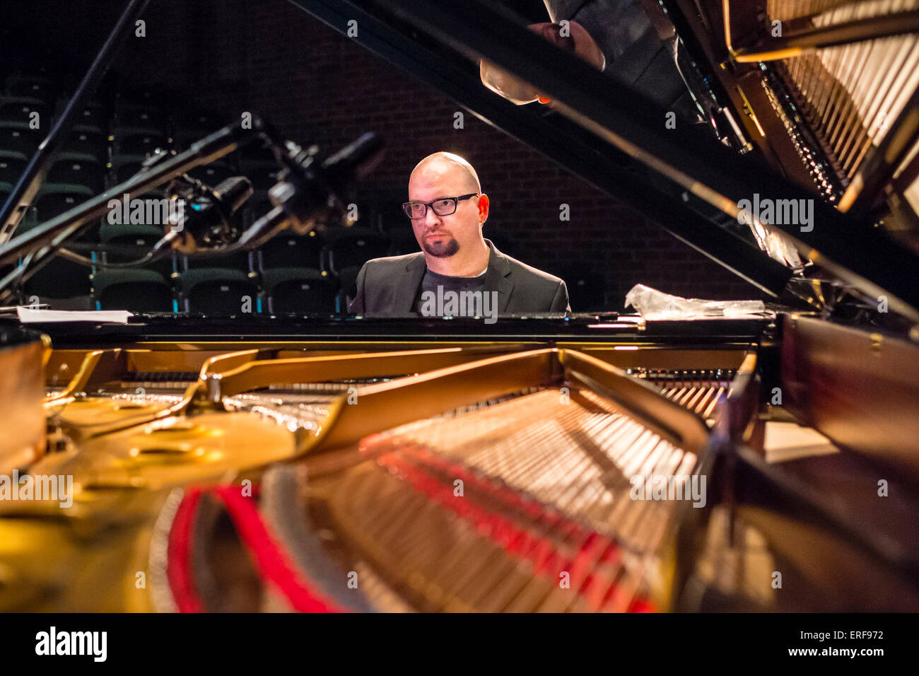 Ethan Iverson playing piano during sound check with The Bad Plus at the ...