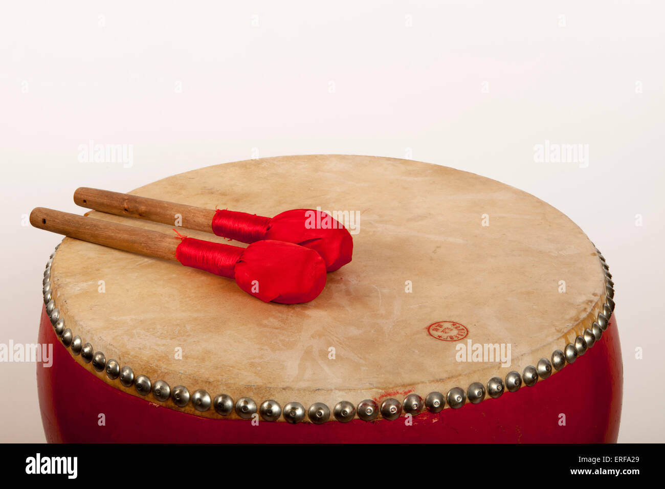 Chinese Double headed barrel drum suspended on a wooden frame, played with two cloth covered beaters Stock Photo
