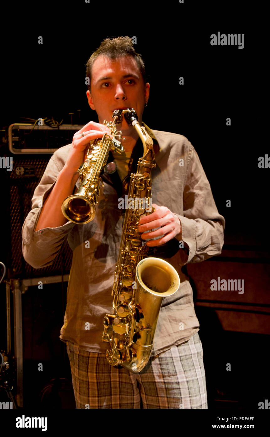 Musician playing soprano and alto saxophones at the same time Stock