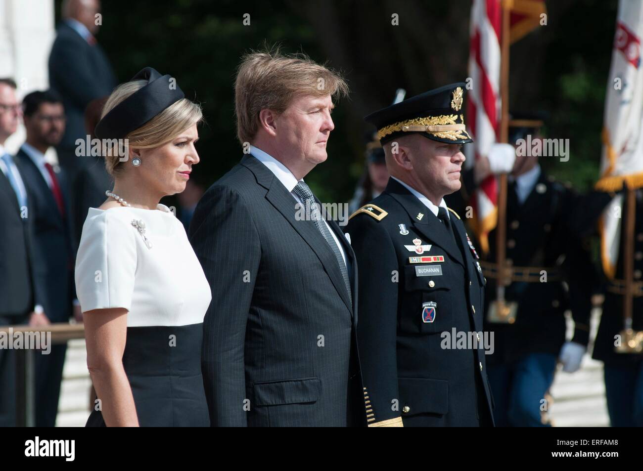 King Willem-Alexander, center, and Her Majesty Queen Maxima of the Netherlands stand with Maj. Gen. Jeffrey S. Buchanan, during a wreath ceremony at the Tomb of the Unknown Soldier in Arlington National Cemetery June 1, 2015, in Arlington, Virginia. Stock Photo