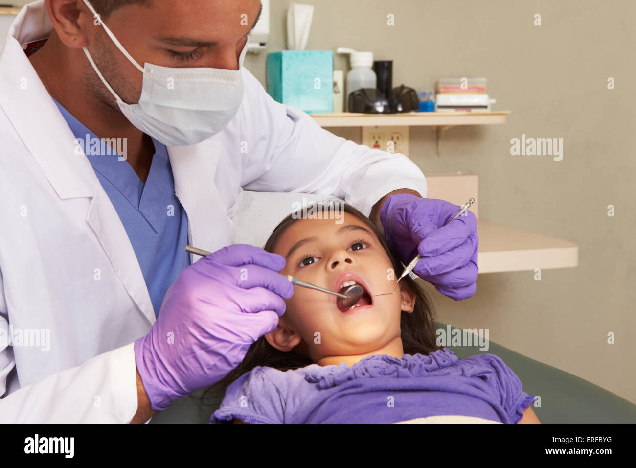 Young Girl Having Check Up At Dentists Surgery Stock Photo