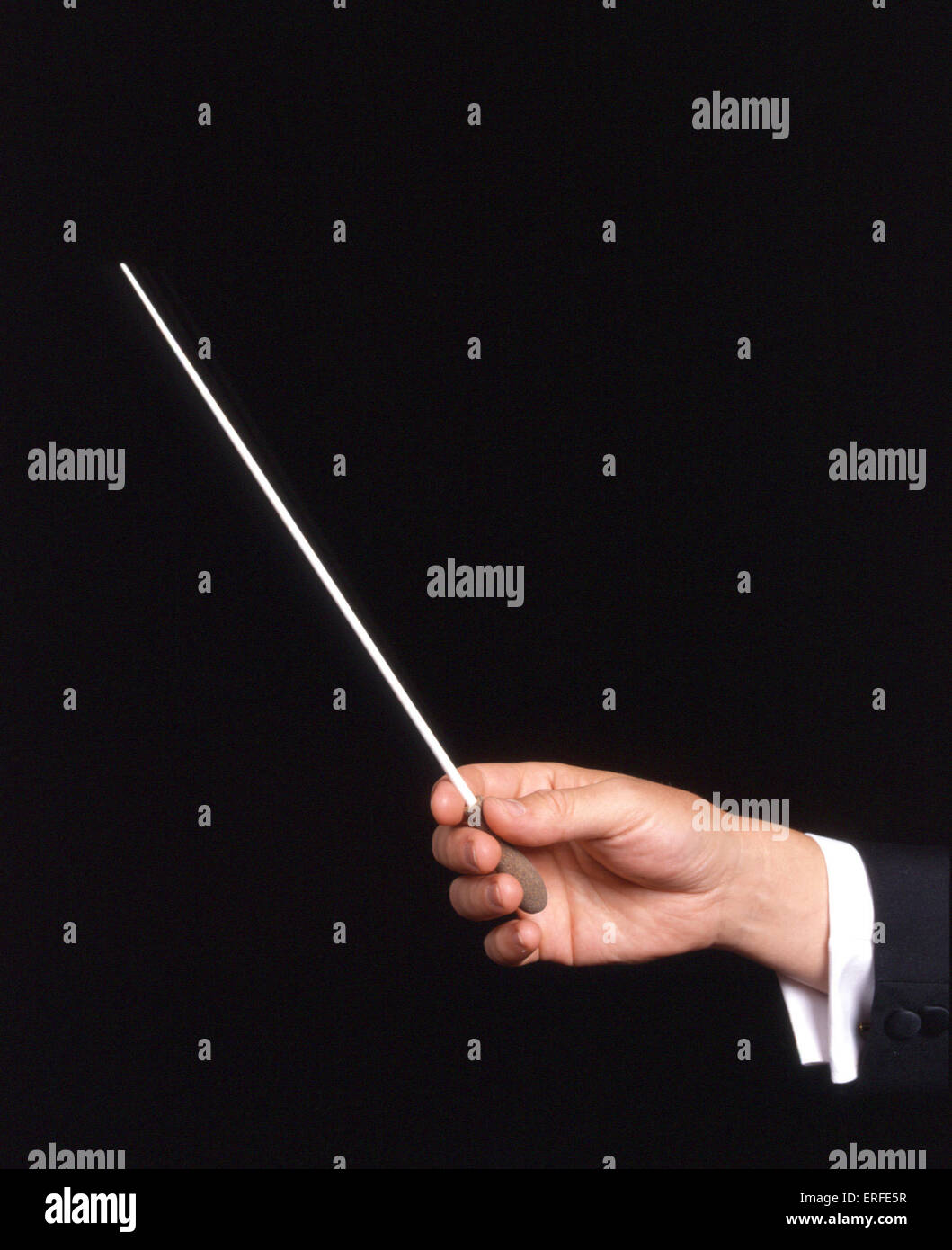 Conductor 's hands pictured, one holding a baton Stock Photo Alamy