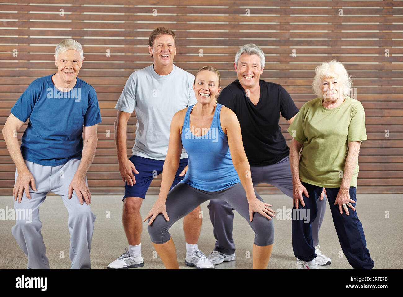 Happy senior group taking dancing lessons together in a gym Stock Photo