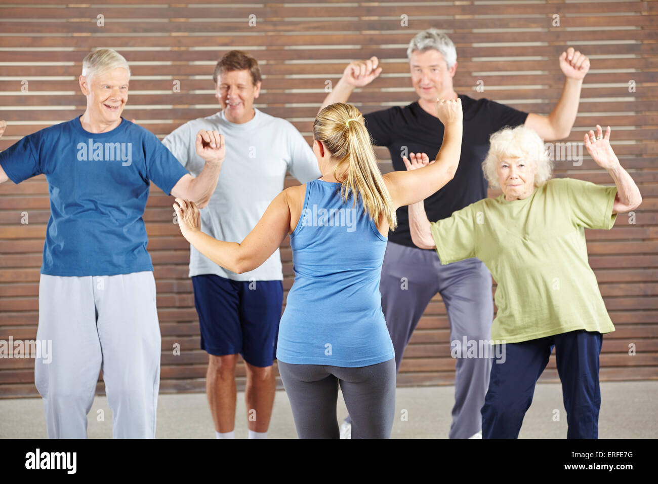 Dancing class with happy senior people in a gym Stock Photo