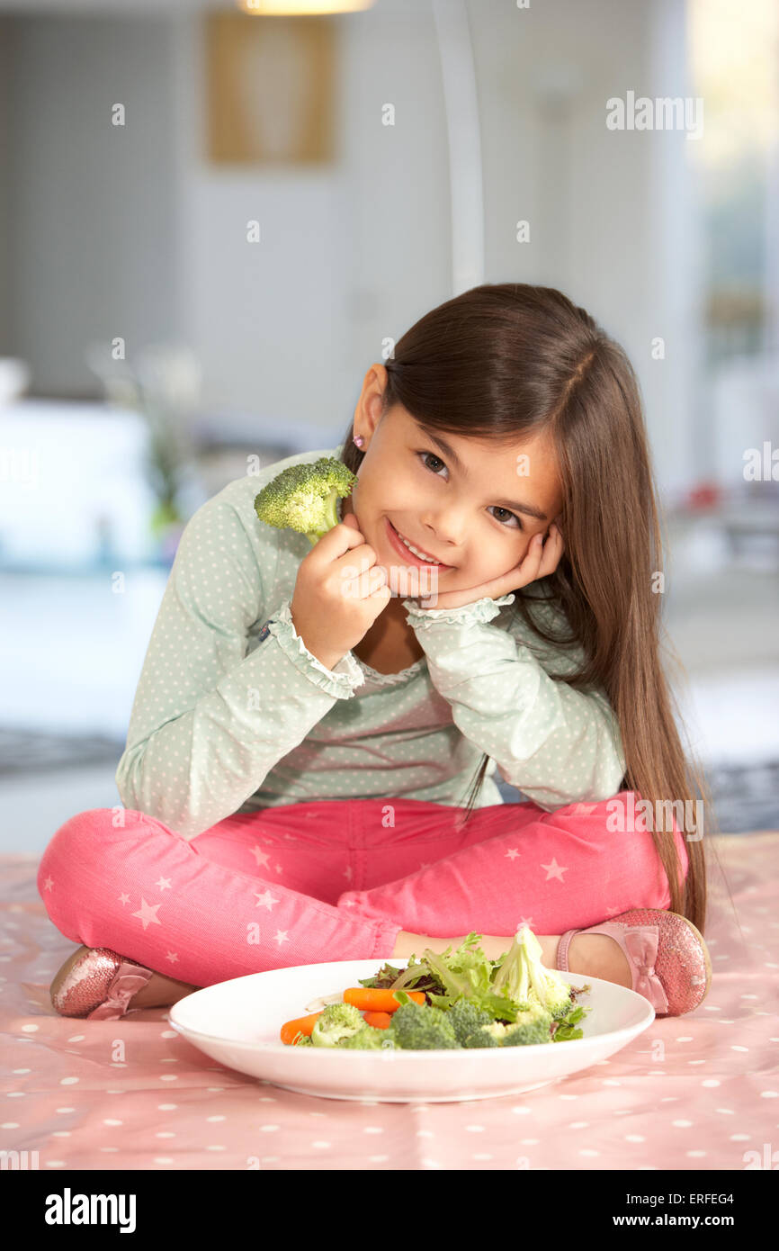 Happy Young Girl With Plate Of Fresh Vegetables Stock Photo
