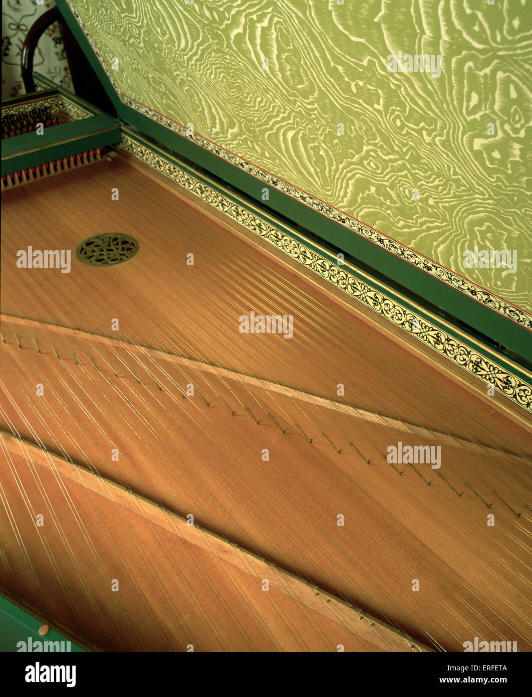 Harpsichord with open lid, showing strings, soundboard and soundholes