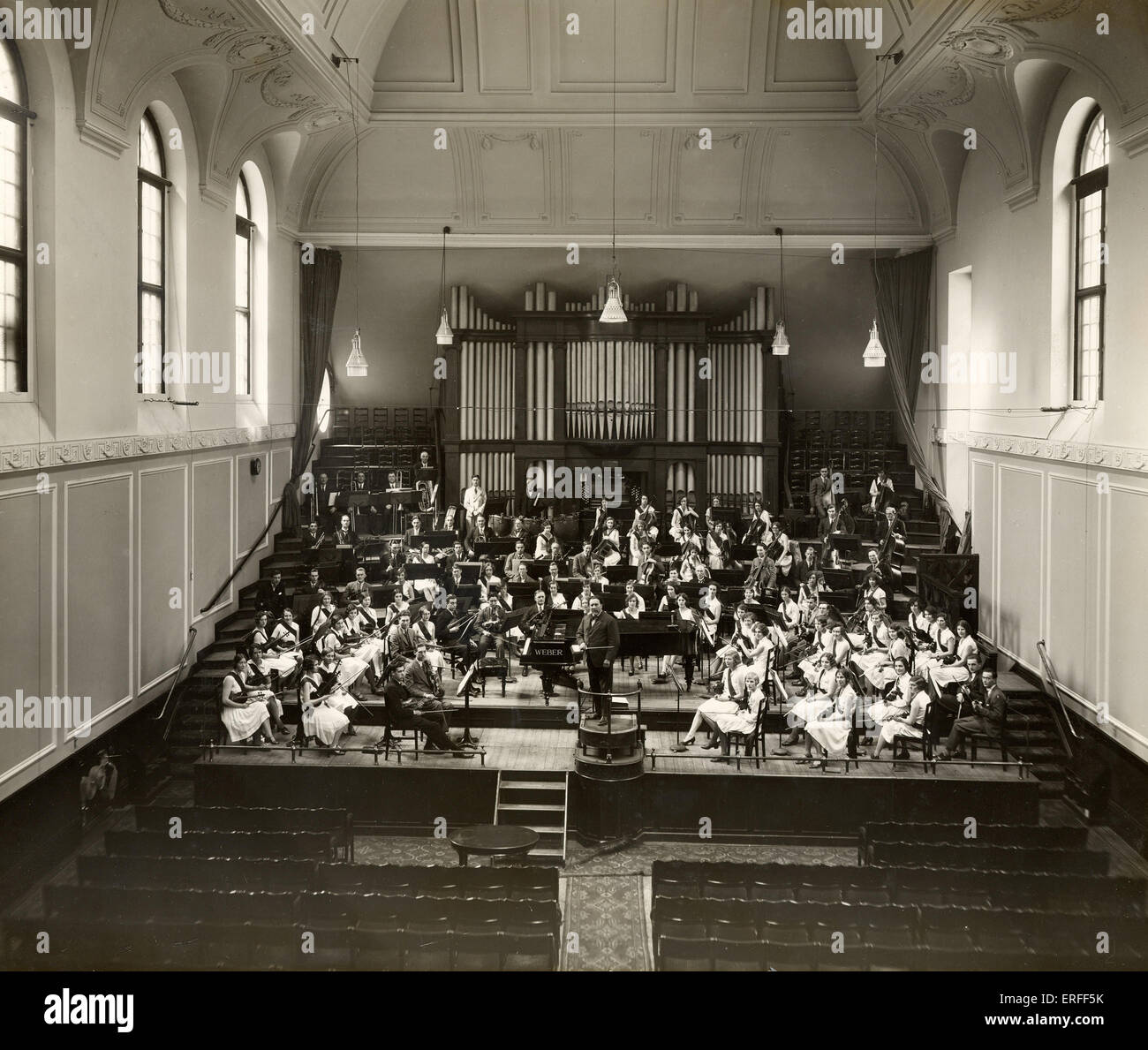 Henry Wood conducting the Royal Academy of Music Students' Orchestra, June 1930. Duke's Hall with organ. English conductor, Stock Photo