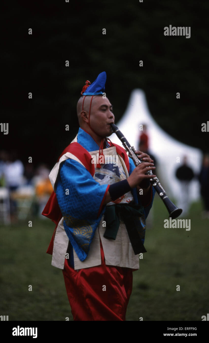 Entertainer in traditional Japanese costume playing at Japan