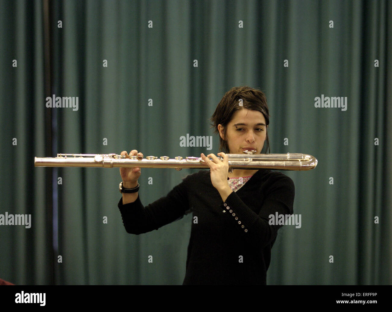 Tina Hitchens playing bass flute. Stock Photo