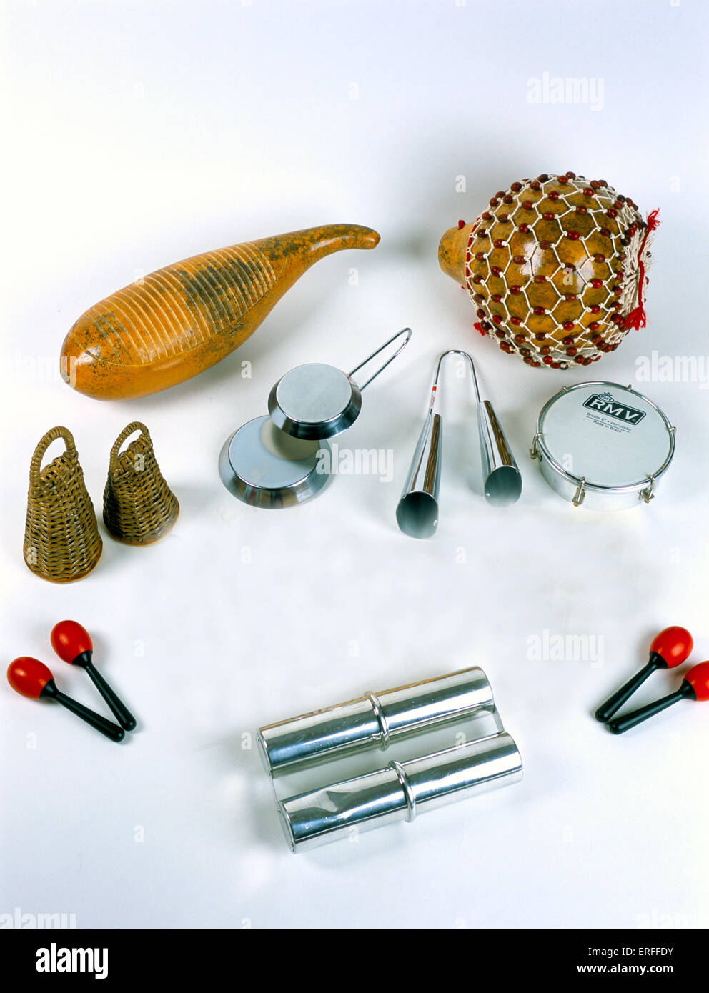 Latin American percussion instruments. Guiro, Shekerere, Caxixi, Frying Pan Agogo Bells, Standard Ago go Bells, Tambourim, Stock Photo