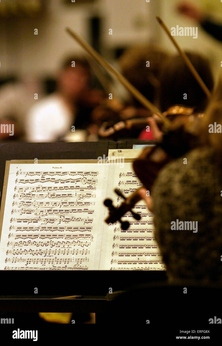 Orchestral music in violin section - during rehearsal Stock Photo