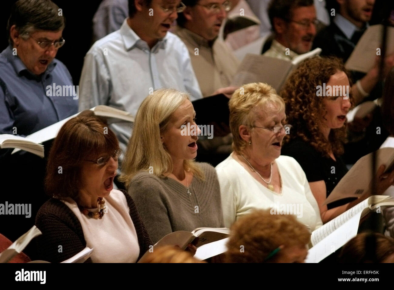 Female singers in a choir, holding song sheets Stock Photo Alamy