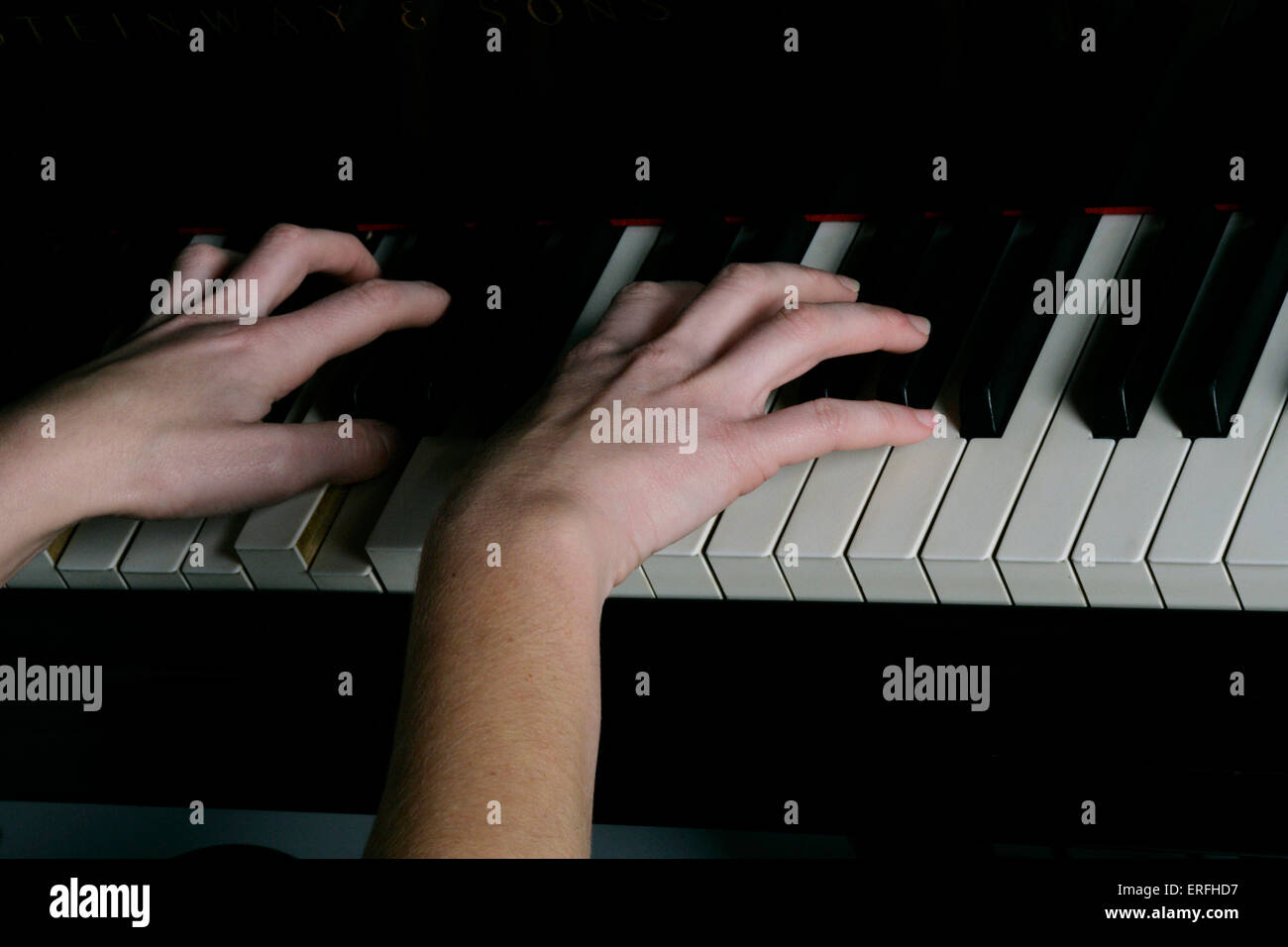 Piano - close-up of a female pianist 's hands on the keyboard. Stock Photo