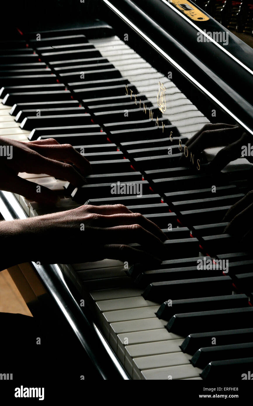 Piano - close-up of a female pianist 's hands playing a Steinway grand piano.   Amanda Buckley Stock Photo