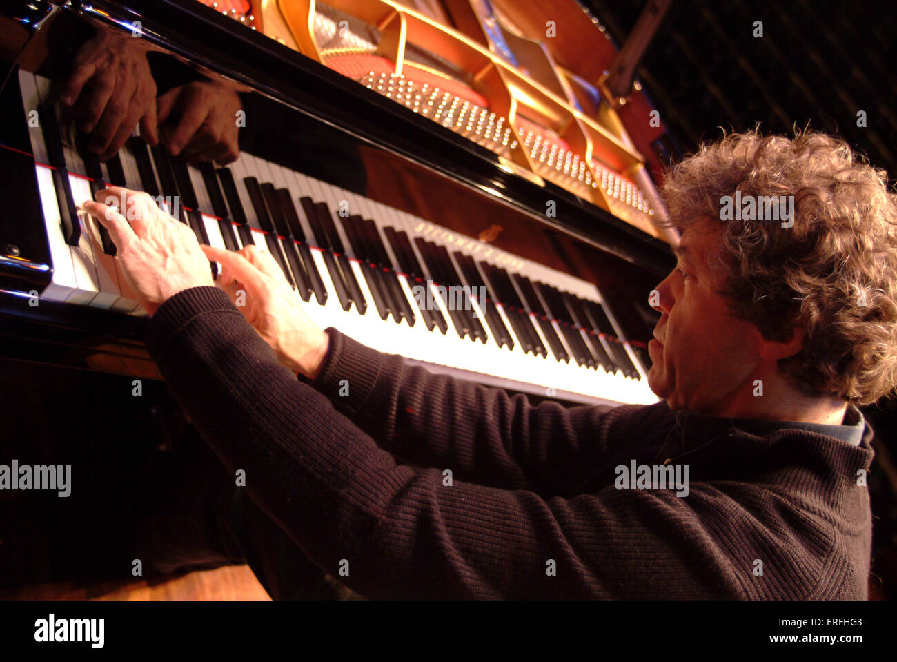 Pascal Rogé at the piano rehearsing at the Queen Elizabeth Hall 23 January,  2006. French pianist b. 4 June 1951 Stock Photo - Alamy