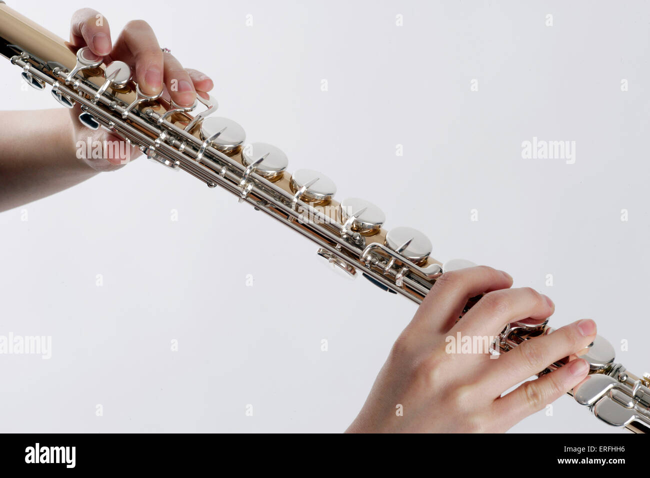 Alto flute close up of the wind instrument held in the playing