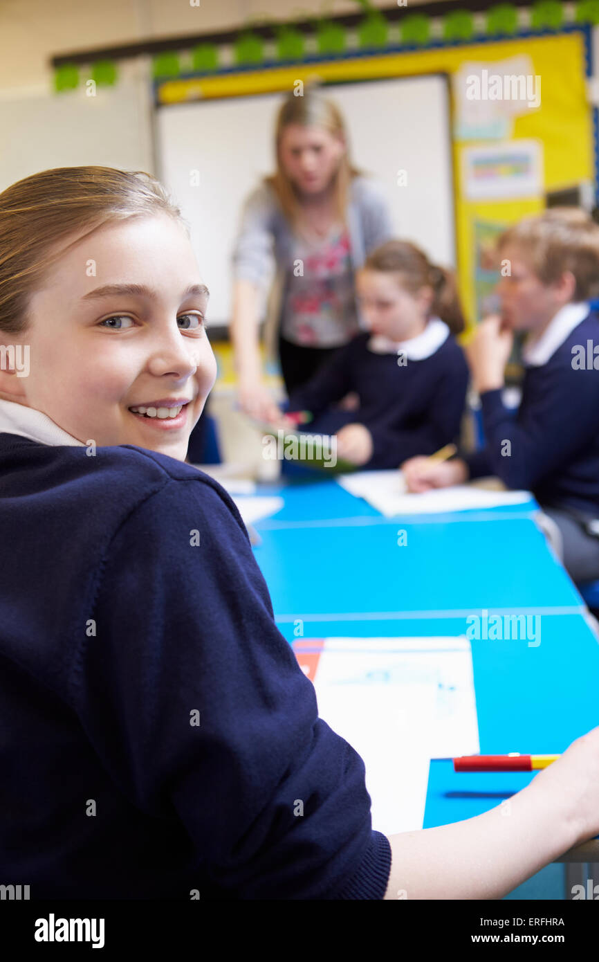 Portrait Of Pupil In Classroom With Teacher Stock Photo - Alamy