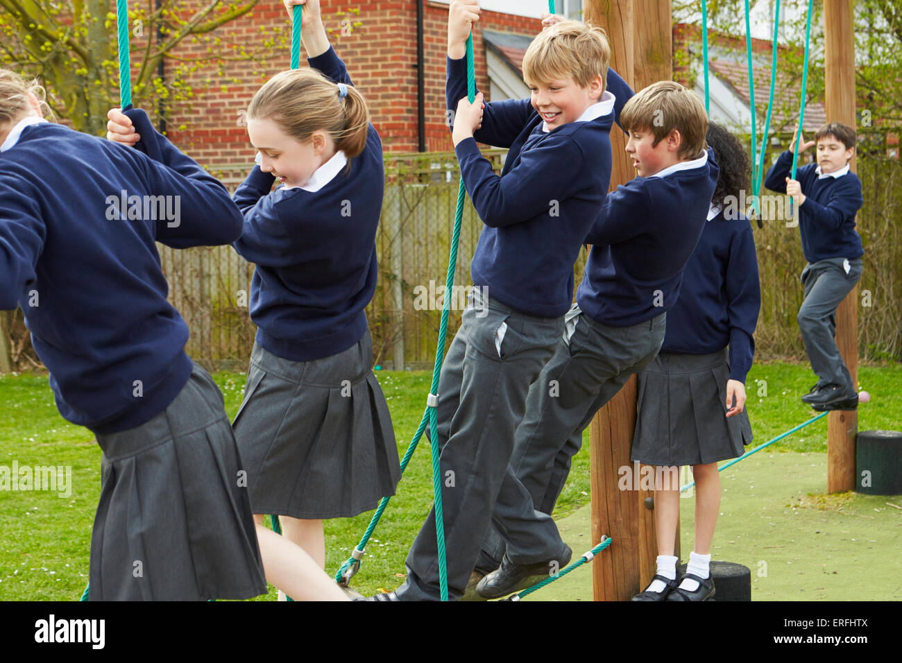 Elementary School Pupils On Climbing Equipment Stock Photo - Alamy