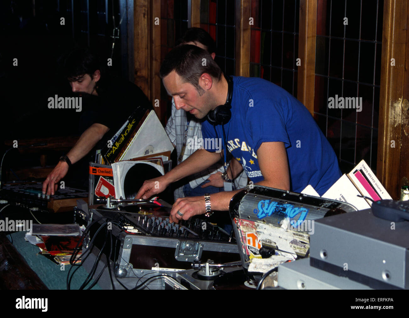 Matt Smooth - portrait of the male hip hop DJ playing records in a disco / club, 2001. Deejay. Disco. Turntable. Stock Photo