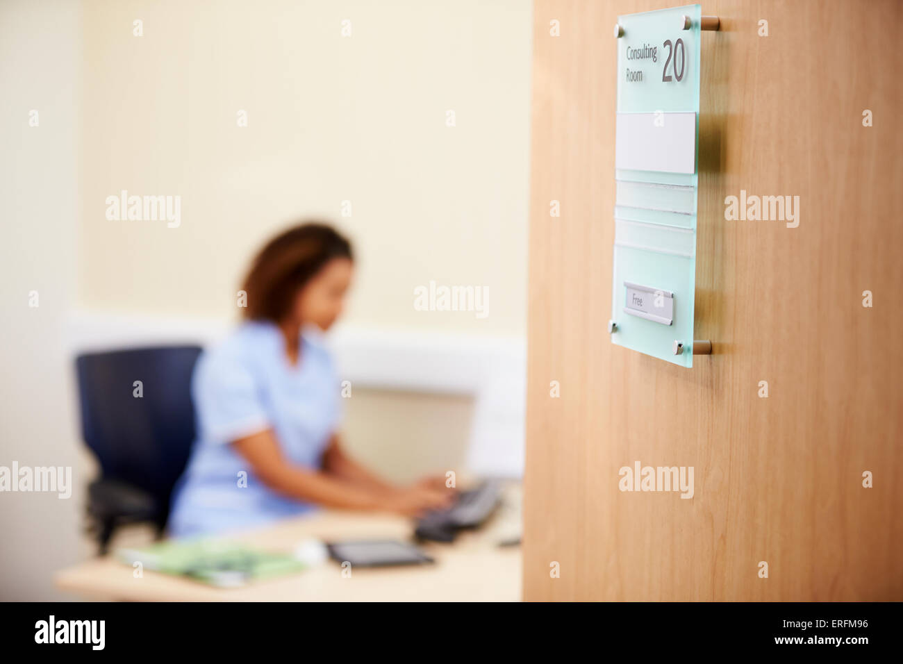 Female Nurse Working At Desk In Office Stock Photo Alamy