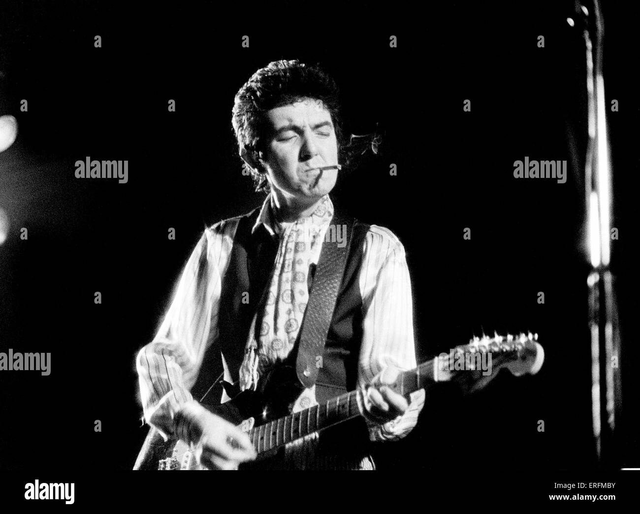 Ronnie Lane - portrait of the English singer & bass player performing in London, 1980. Cigarette in mouth. 1946-1997. Nicknamed Stock Photo