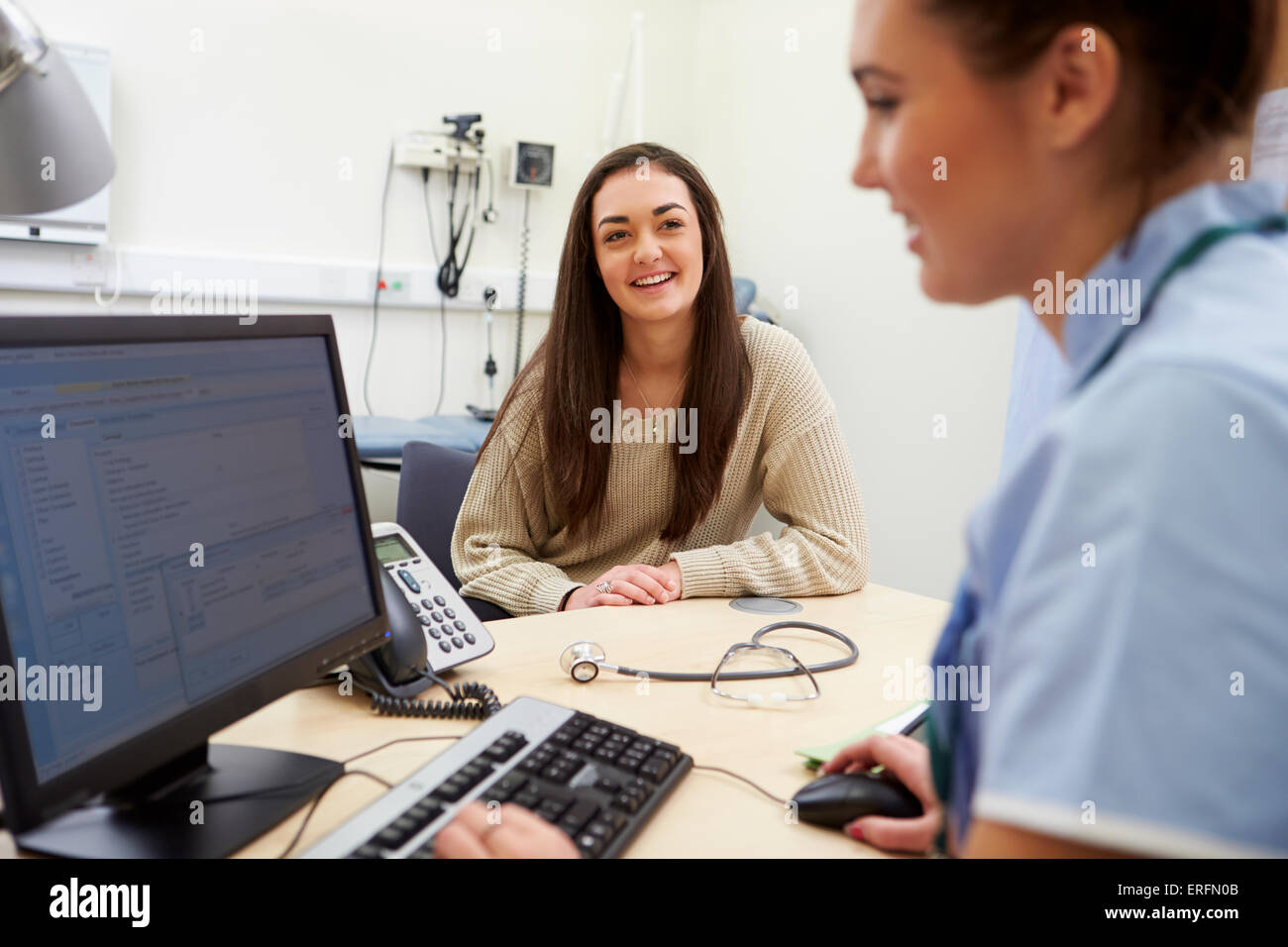 Teenage Girl Has Appointment With Nurse Stock Photo