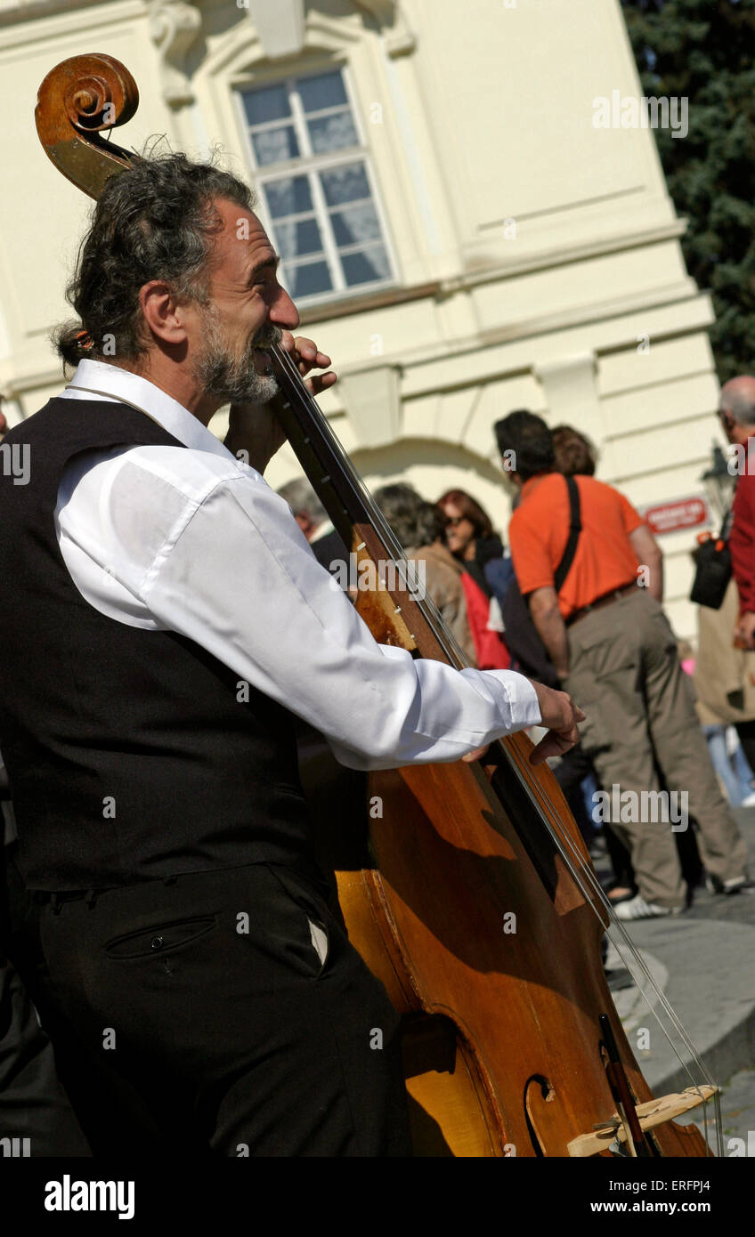 Street musician, double bass player - in Prague. Stock Photo