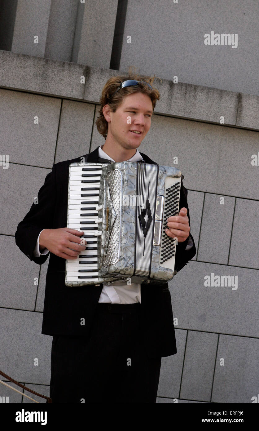 Street musician, accordion player - in Prague. Stock Photo