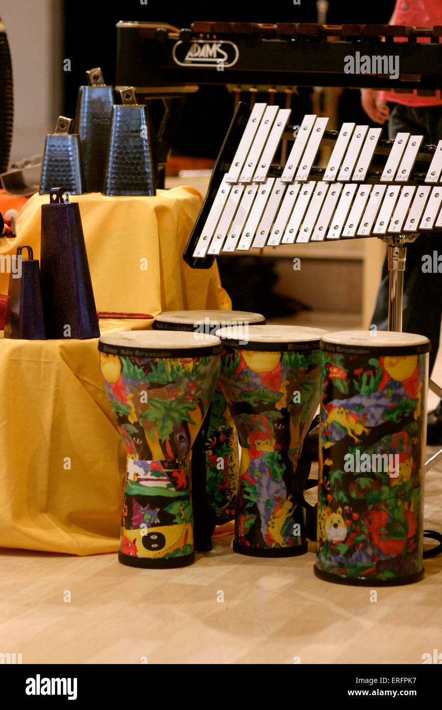 Group of percussion instruments - comprising drums, shakers, cowbells, guiro and a glockenspiel. Stock Photo