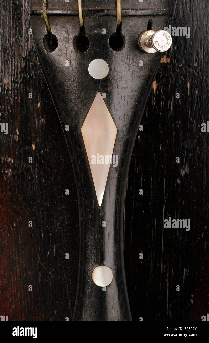 Violin tailpiece Close up of tailpiece decorated with mother of