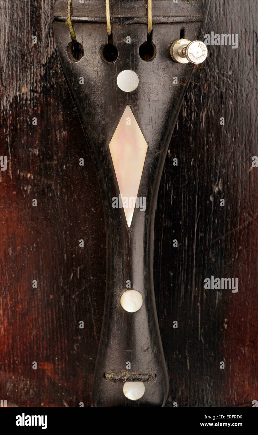 Violin tailpiece Close up of tailpiece decorated with mother of