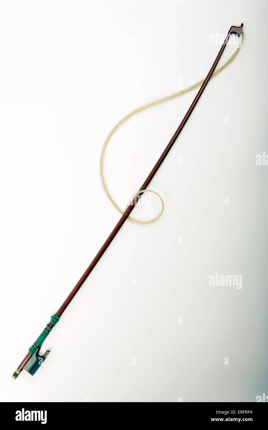 Violin bow  - hair arranged to look like a treble clef. Musical symbol. Stock Photo