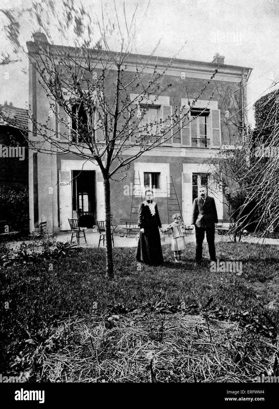 Pierre and Marie Curie with their duaghter Irene in the garden of the house on Boulevard Kellerman, 1908. MC: Polish-born French physicist and pioneer in radioactivity, 7 November 1867 – 4 July 1934. PC: French physicist and pioneer in radioactivity, 15 May 1859 – 19 April 1906. Stock Photo