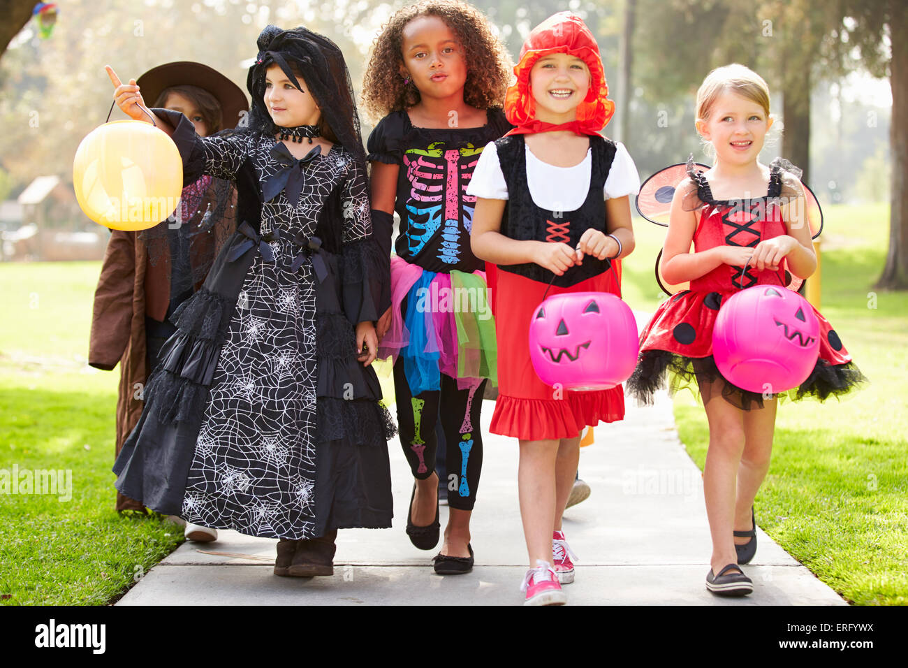 Children In Fancy Costume Dress Going Trick Or Treating Stock Photo