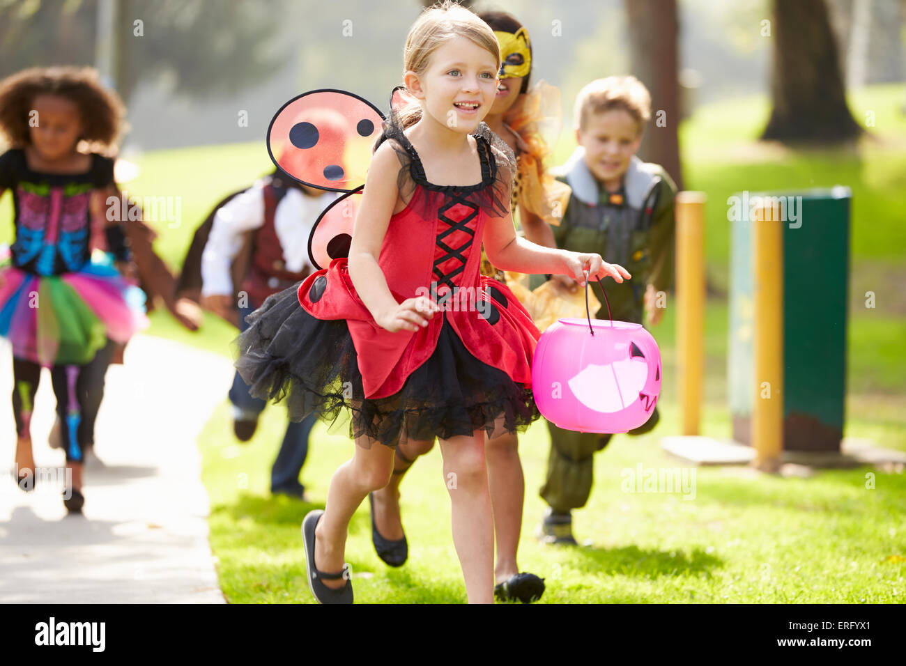 Children In Fancy Costume Dress Going Trick Or Treating Stock Photo