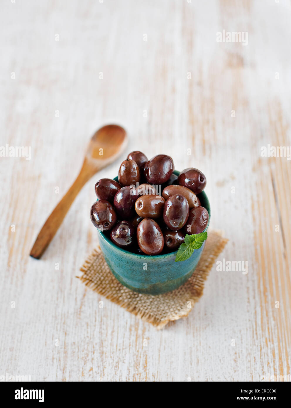 Fresh spanish olives in a rustic bowl. Typical spanish tapa. Typical