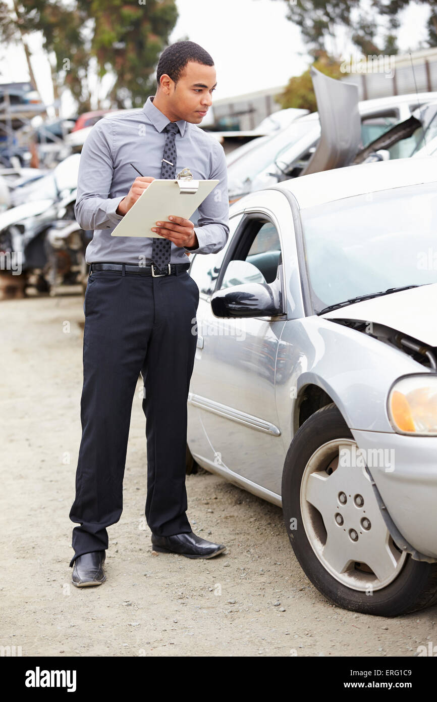 Loss Adjuster Inspecting Car Involved In Accident Stock Photo Alamy