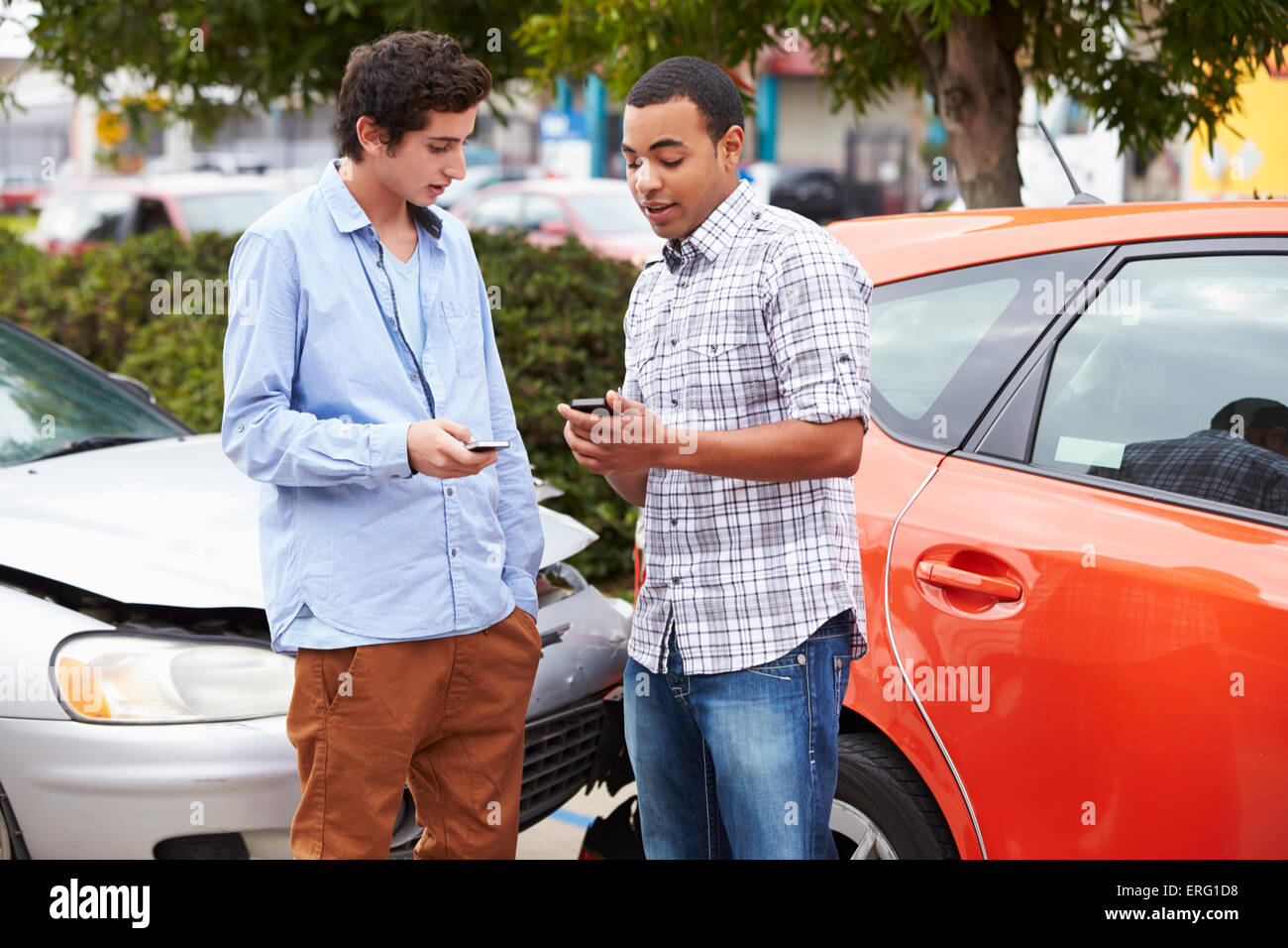 Two Drivers Exchange Insurance Details After Accident