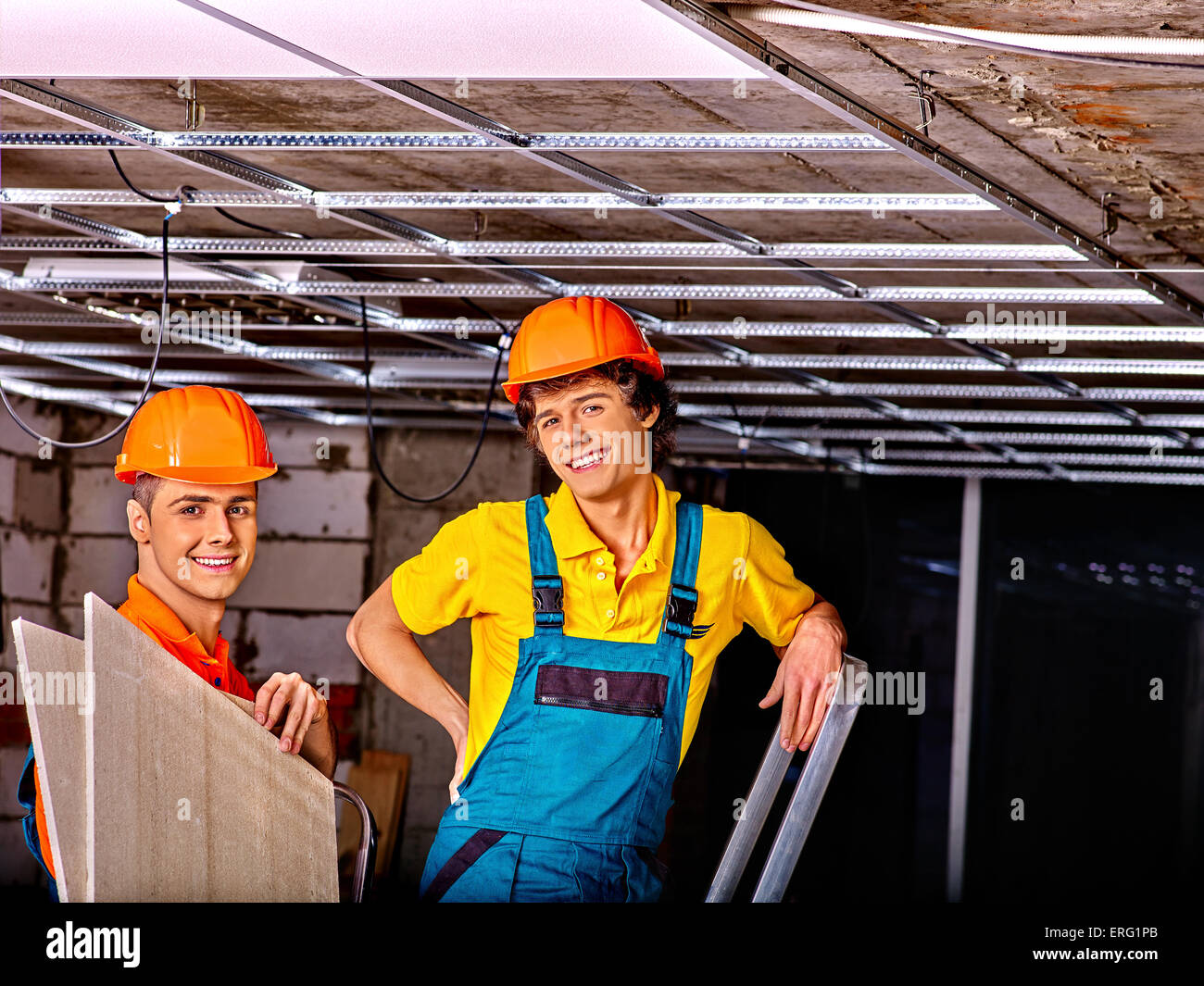 Man installing suspended ceiling Stock Photo - Alamy