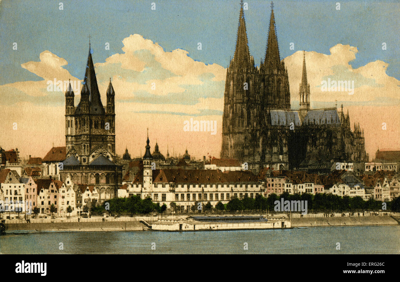 Cologne, Germany, early 20th century. View  shows cathedral  with 2 spires overlooking the river Rhine.  Köln, Stapelhaus and Stock Photo