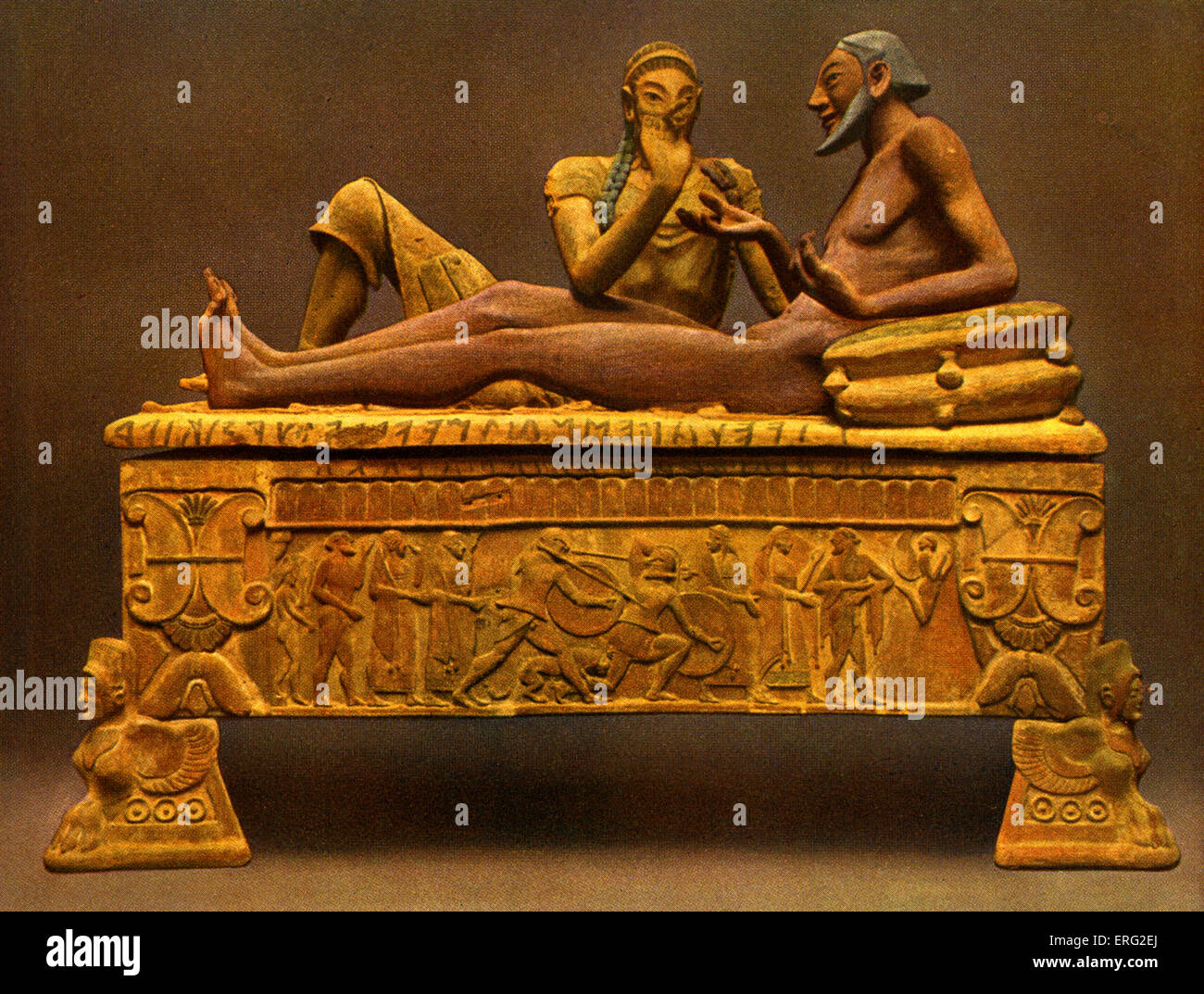 Painted Etruscan sarcophagus, showing a reclining man in conversation with winged beast feet and a military scene.  Found at Stock Photo