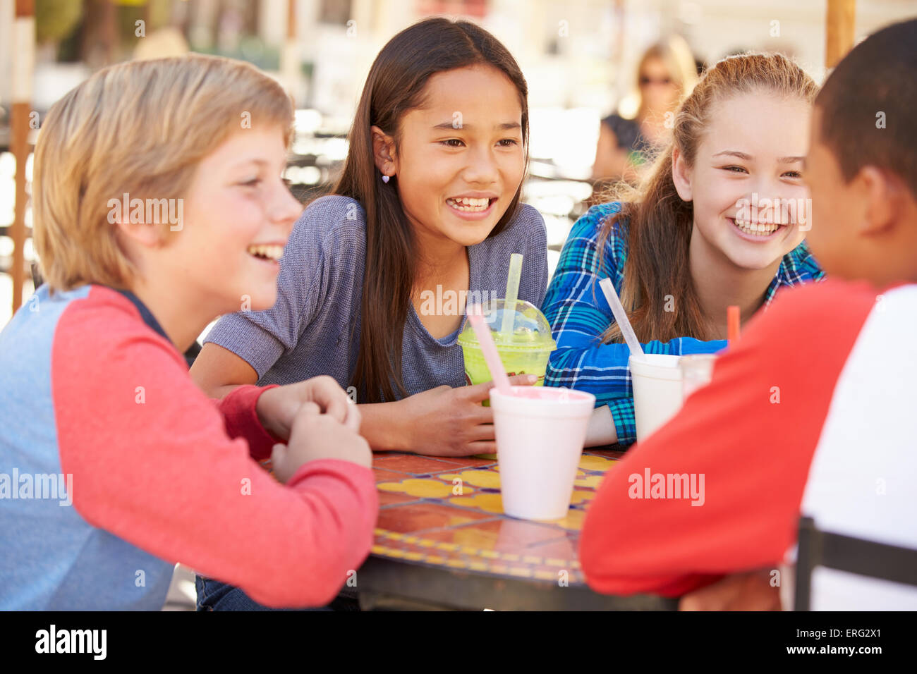 Group Of Children Hanging Out Together In CafÅ½ Stock Photo