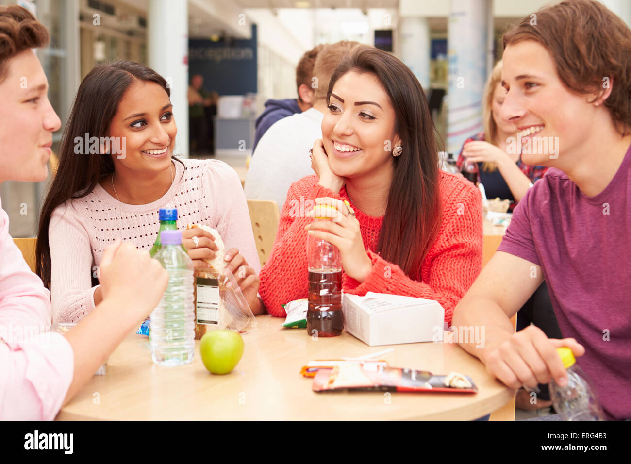 Group Of College Students Eating Lunch Together Stock Photo