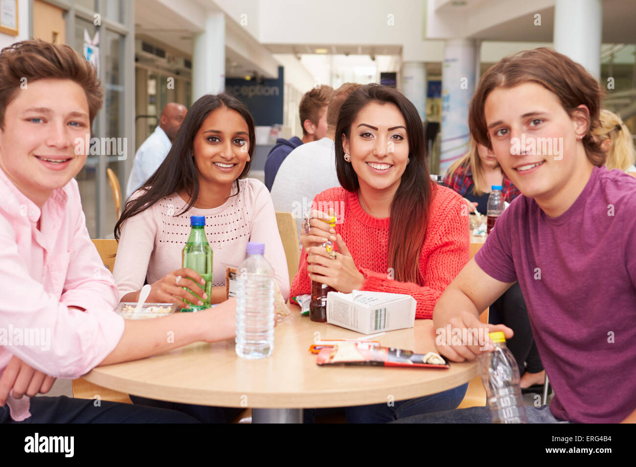 Group Of College Students Eating Lunch Together Stock Photo