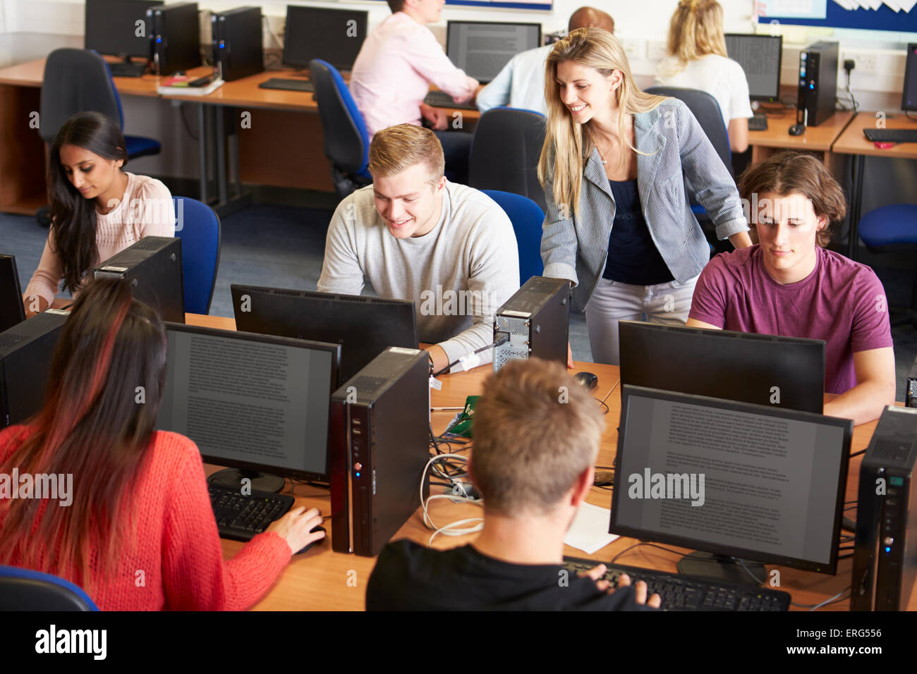 College Students At Computers In Technology Class Stock Photo