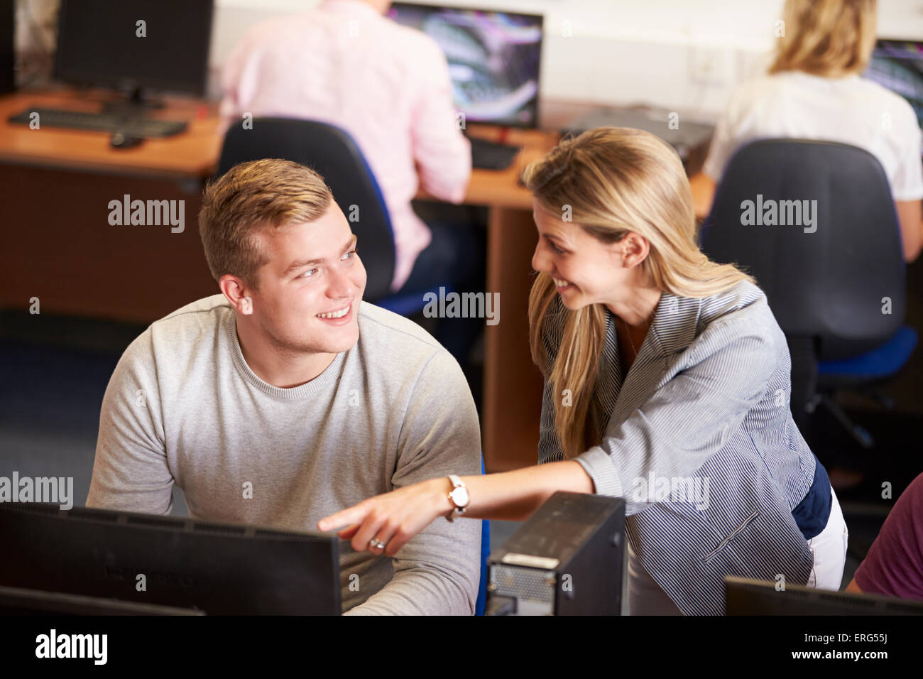 College Students At Computers In Technology Class Stock Photo