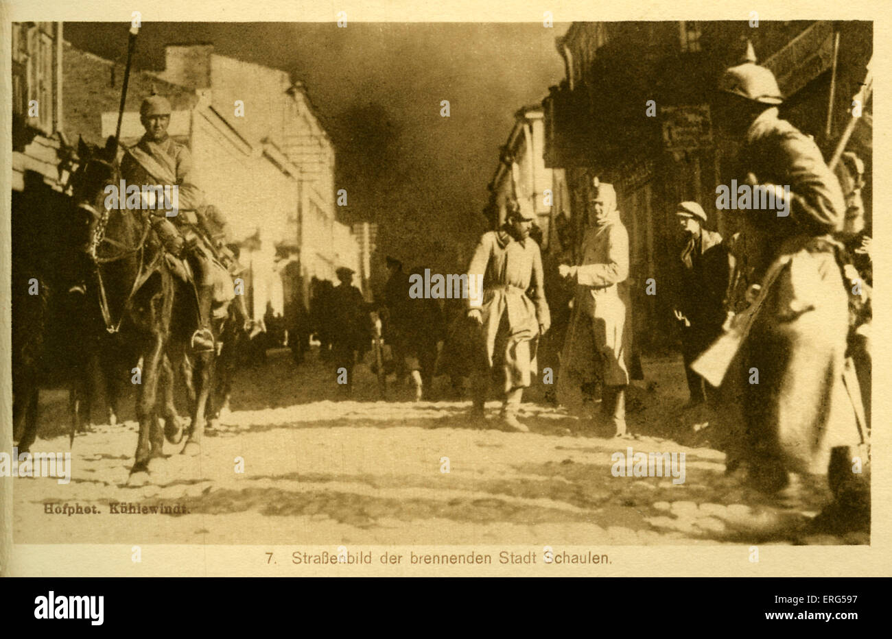 Eastern Front towns under World War I German occupation. Taken from photograph, shows German troops on a burning street in Stock Photo