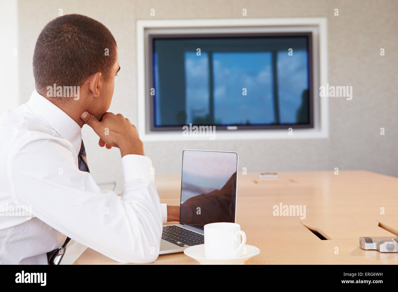 Businessman Having Video Conference In Boardroom Stock Photo