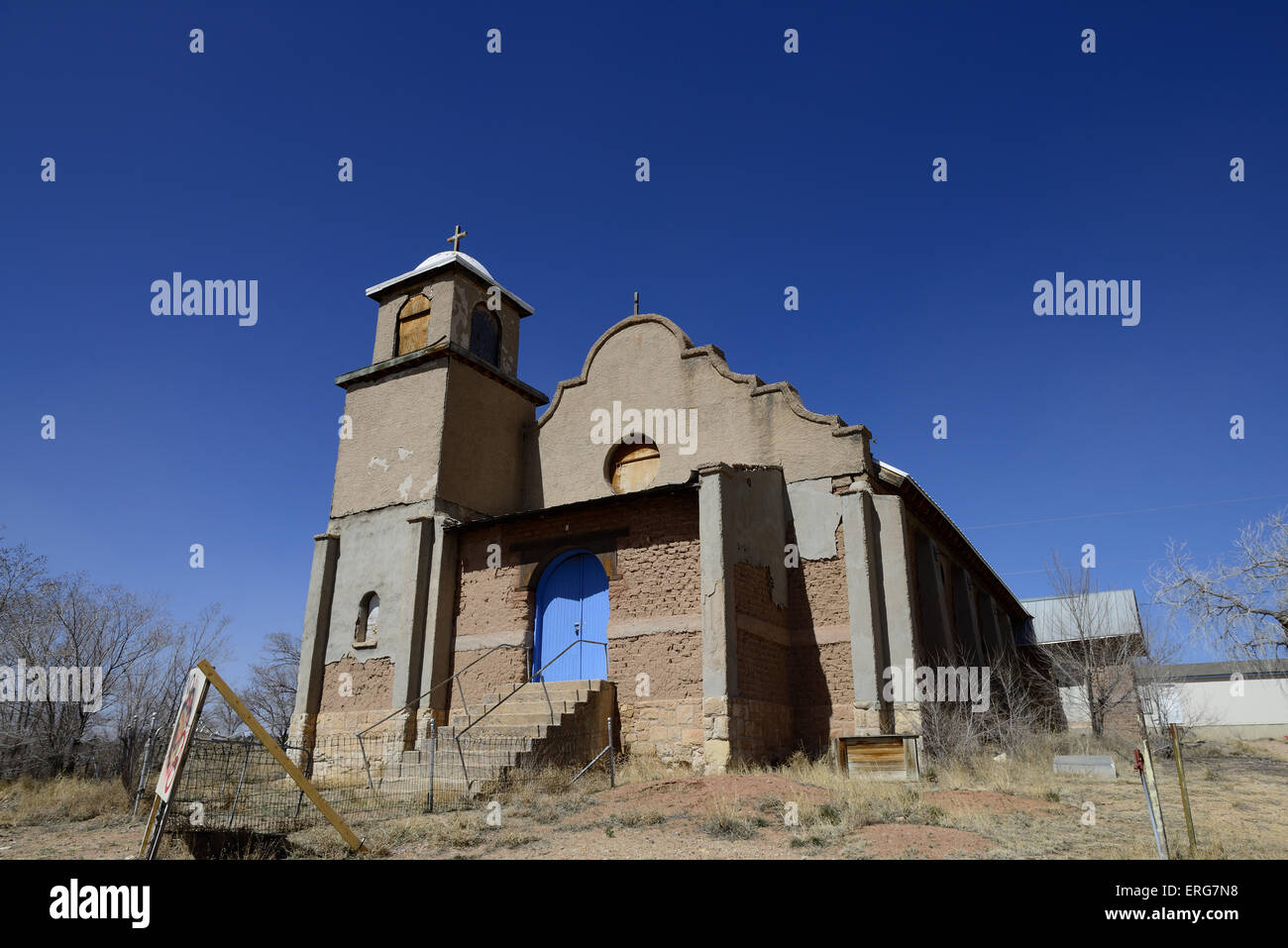Abandoned adobe style church in Lamy, New Mexico on a sunny day. Stock Photo